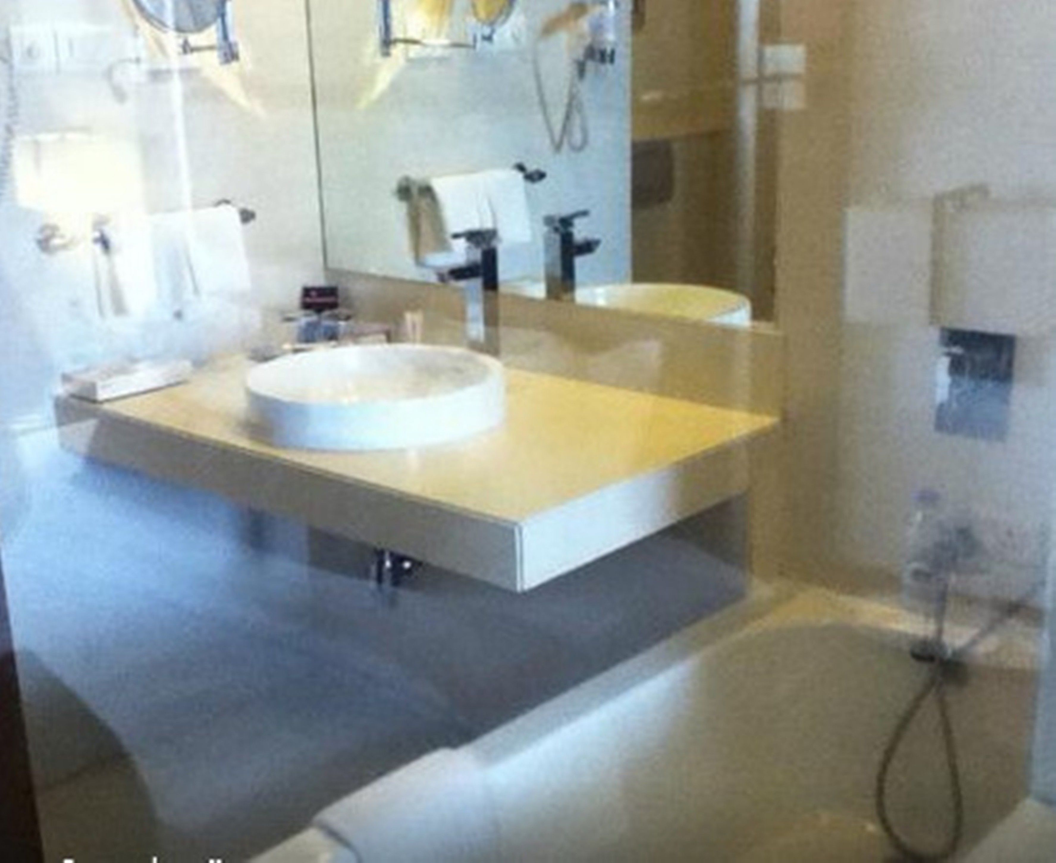 deluxe room with bathtub | bathroom | free toiletries, hair dryer, bathrobes, slippers