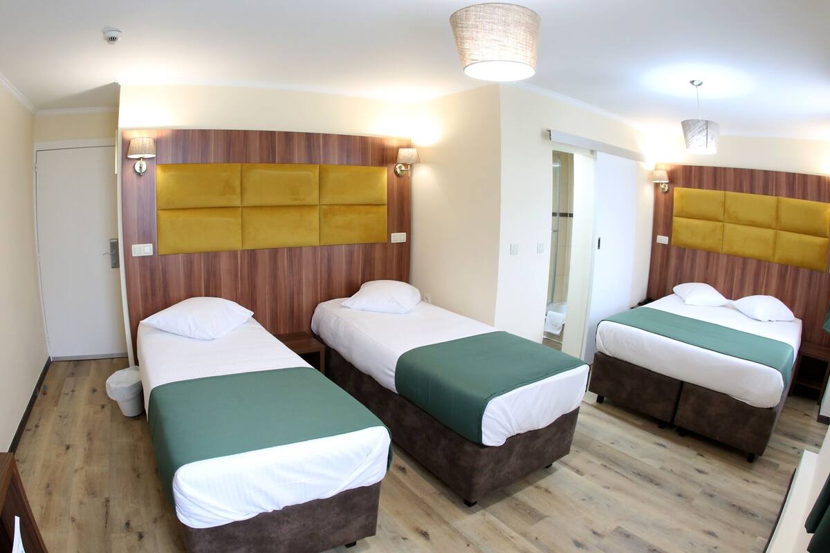 Comfort Quadruple Room | In-room safe, desk, iron/ironing board (on request), WiFi (free)