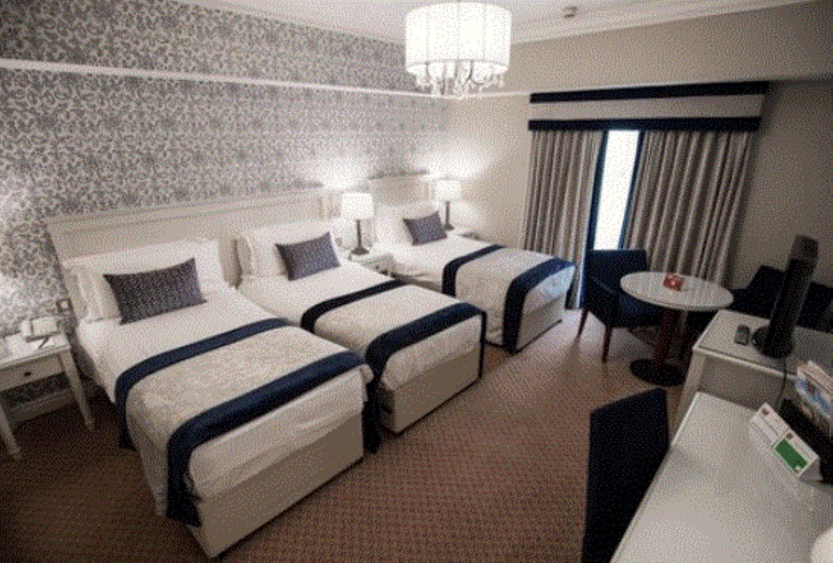 family room | 1 bedroom, in-room safe, desk, laptop workspace