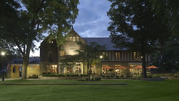 Experience the perfect blend of tradition and modernity in this stately building, featuring a tower and beautifully manicured lawn.