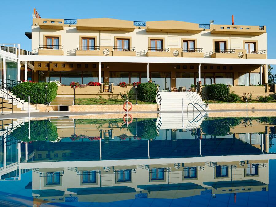 Outdoor pool, an infinity pool, open 11:00 AM to 7:00 PM, pool umbrellas