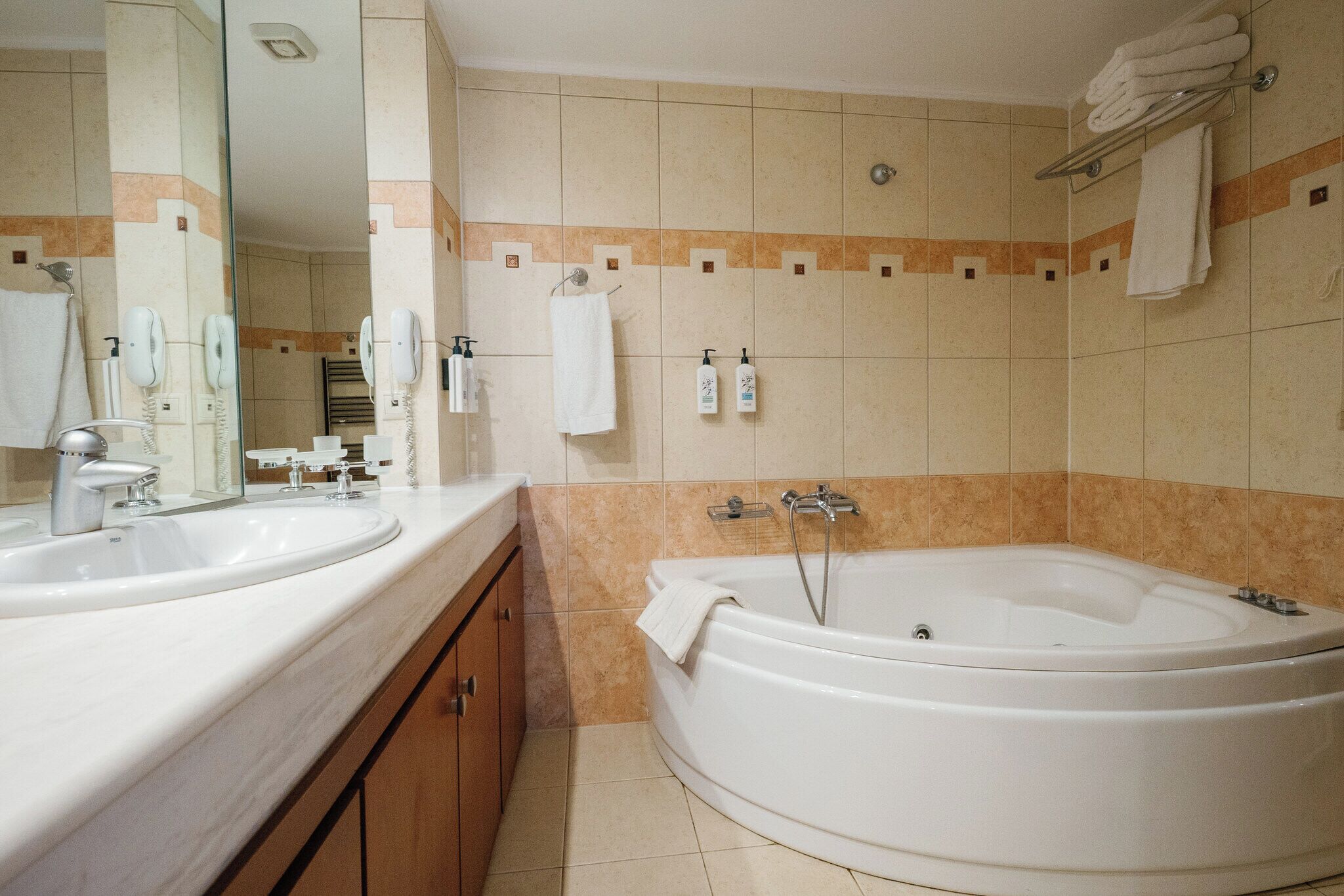 executive suite, jetted tub, sea view | bathroom | bathtub, jetted bath, free toiletries, hair dryer
