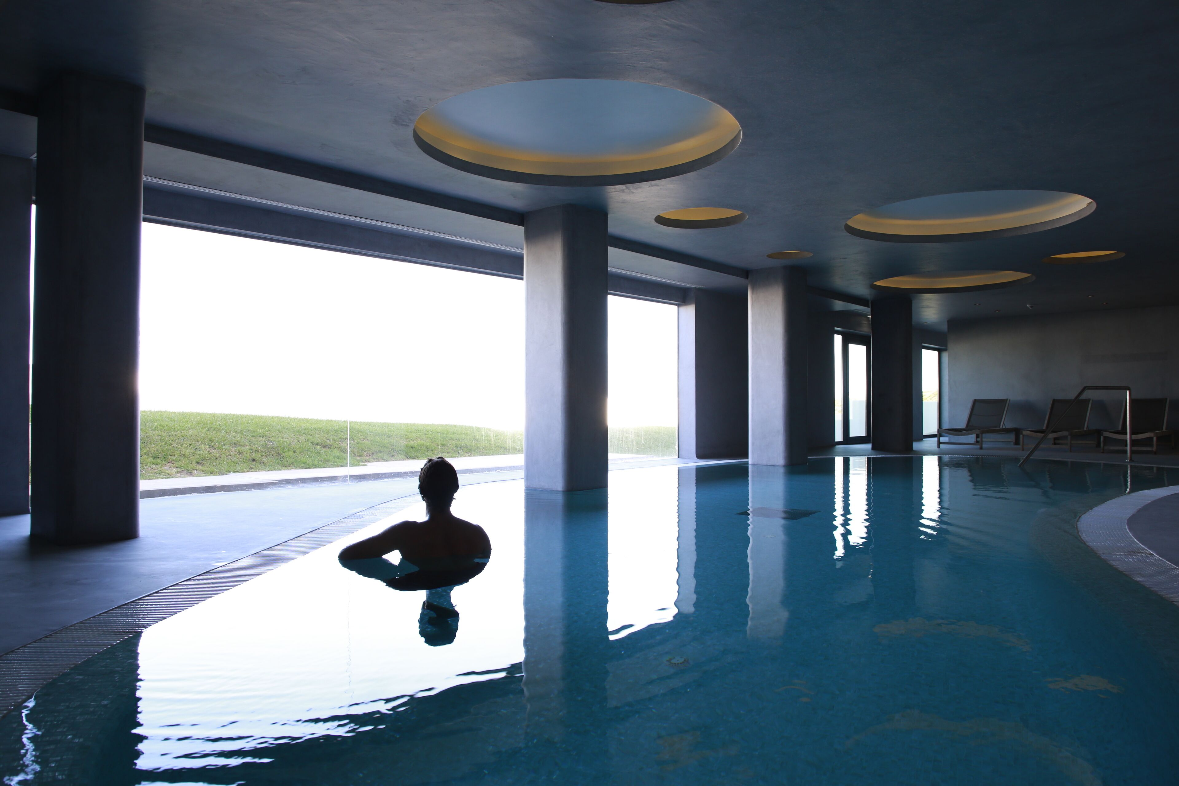 indoor pool, outdoor pool, pool umbrellas, pool loungers