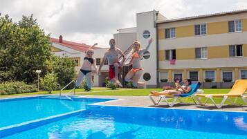Seasonal outdoor pool, pool umbrellas, pool loungers