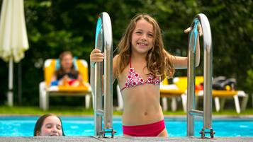 Seasonal outdoor pool, pool umbrellas, pool loungers