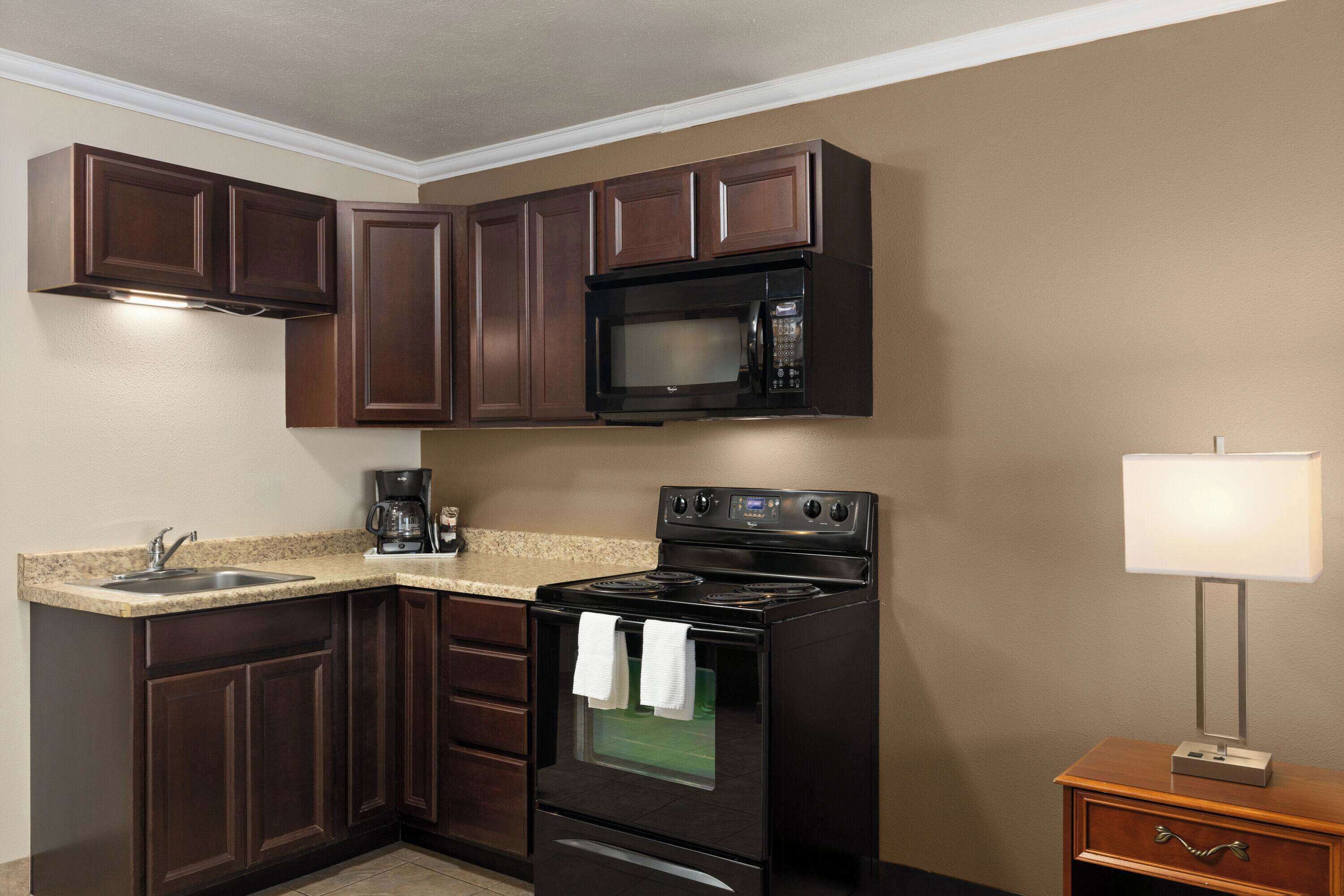 efficiency, studio suite, 1 king bed, non smoking | in-room safe, desk, blackout curtains, iron/ironing board