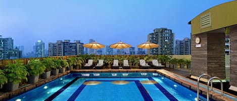 Outdoor pool, open 7:00 AM to 7:00 PM, pool umbrellas, sun loungers