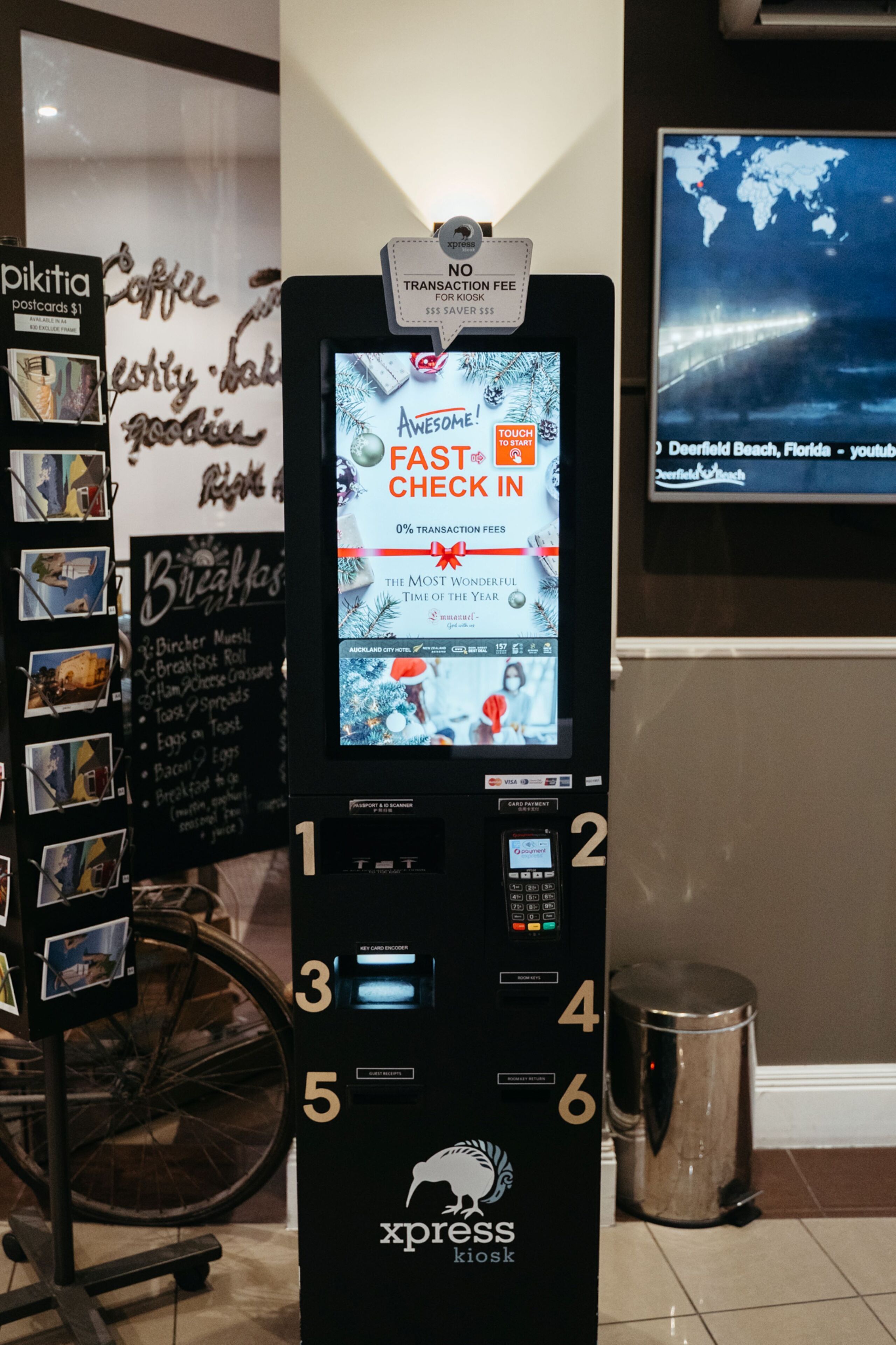A self-service kiosk with a screen displaying a promotional message for a fast check-in service.