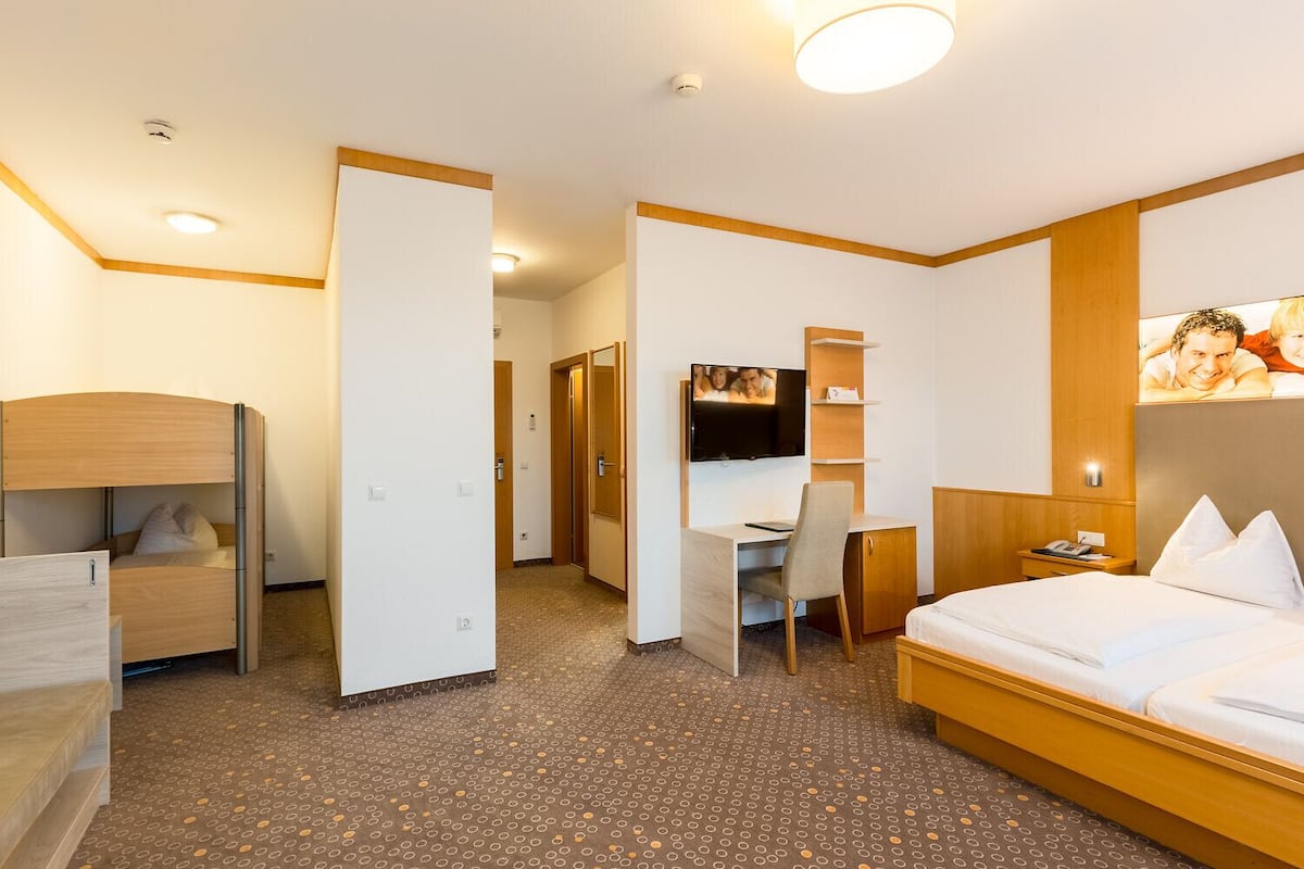 family room | 1 bedroom, in-room safe, desk, blackout curtains