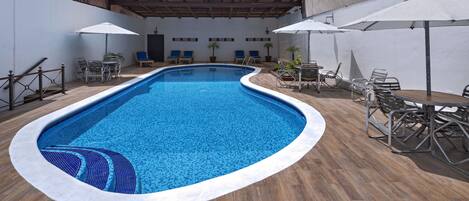 Outdoor pool, open 7 AM to 9:30 PM, pool umbrellas, pool loungers