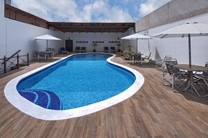 Outdoor pool, open 7 AM to 9:30 PM, pool umbrellas, sun loungers