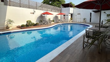 Outdoor pool, open 7 AM to 9:30 PM, pool umbrellas, pool loungers