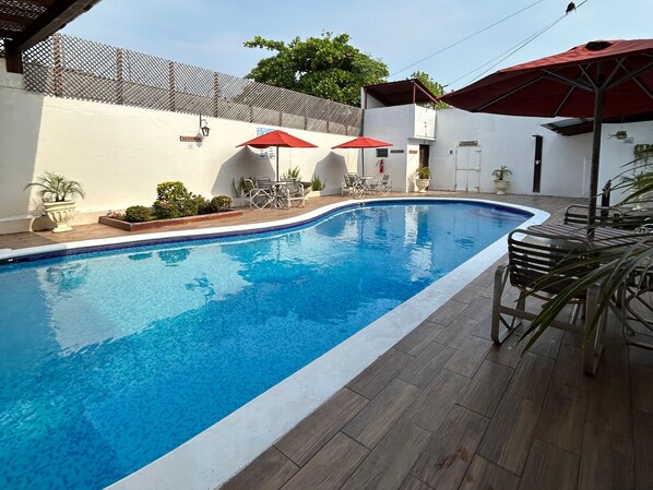 Outdoor pool, open 7 AM to 9:30 PM, pool umbrellas, pool loungers