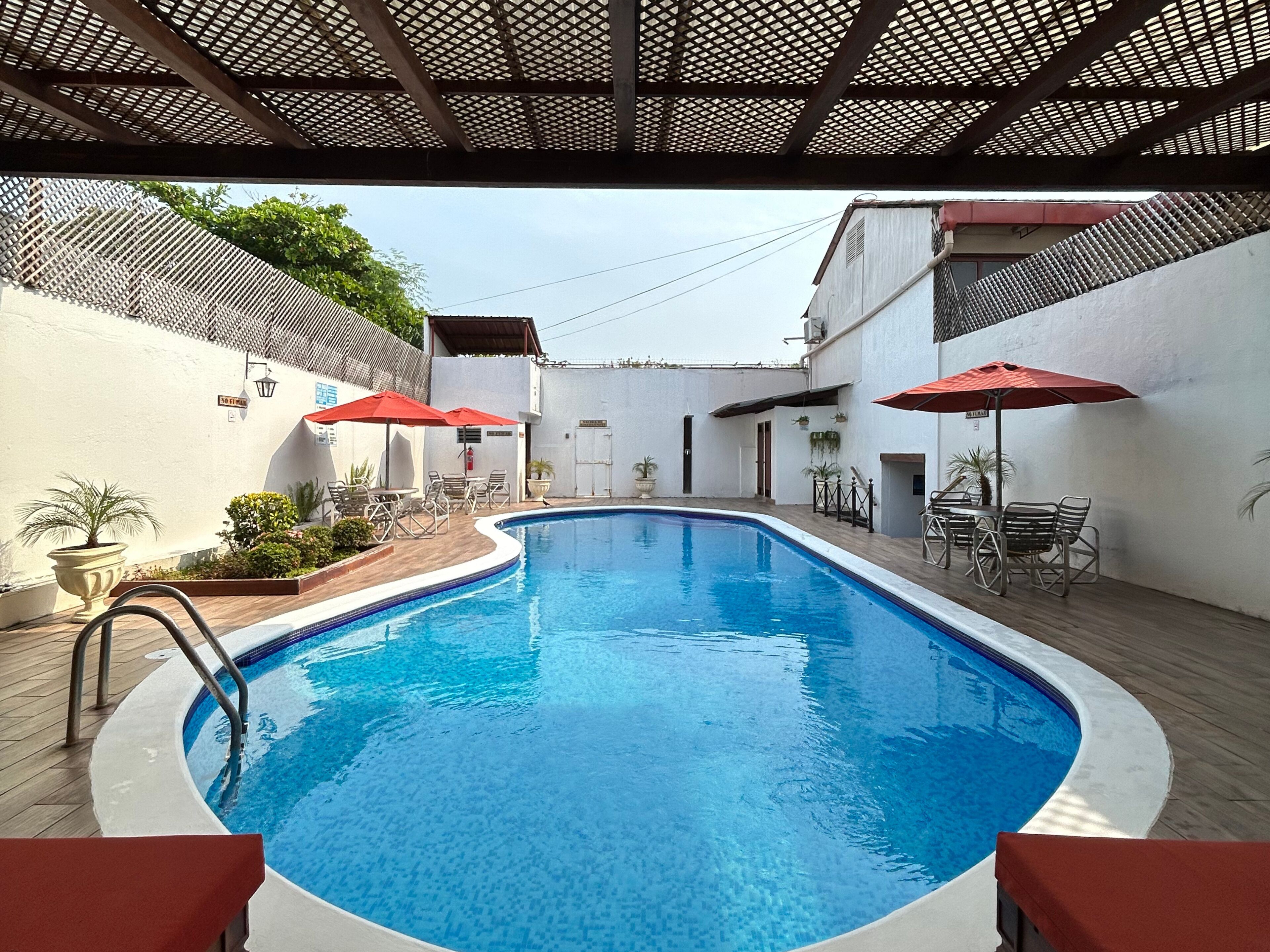 outdoor pool, open 7 am to 9:30 pm, pool umbrellas, pool loungers