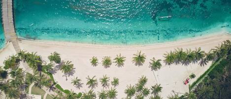 On the beach, white sand, free beach cabanas, sun-loungers