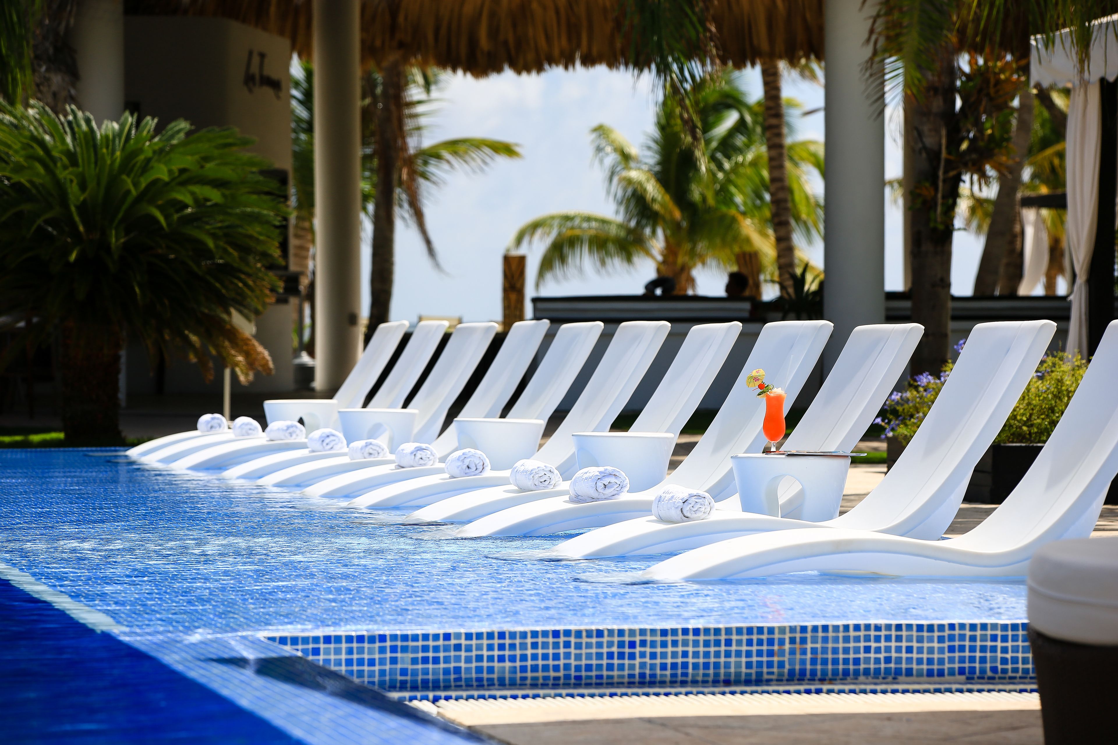Outdoor pool, open 7:00 AM to 10:00 PM, free cabanas, pool umbrellas