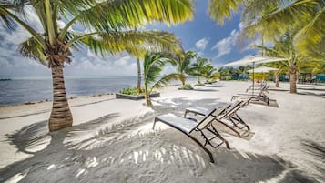 On the beach, white sand, free beach cabanas, sun-loungers