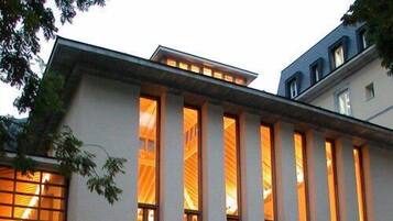 A building with large windows and a stone facade.