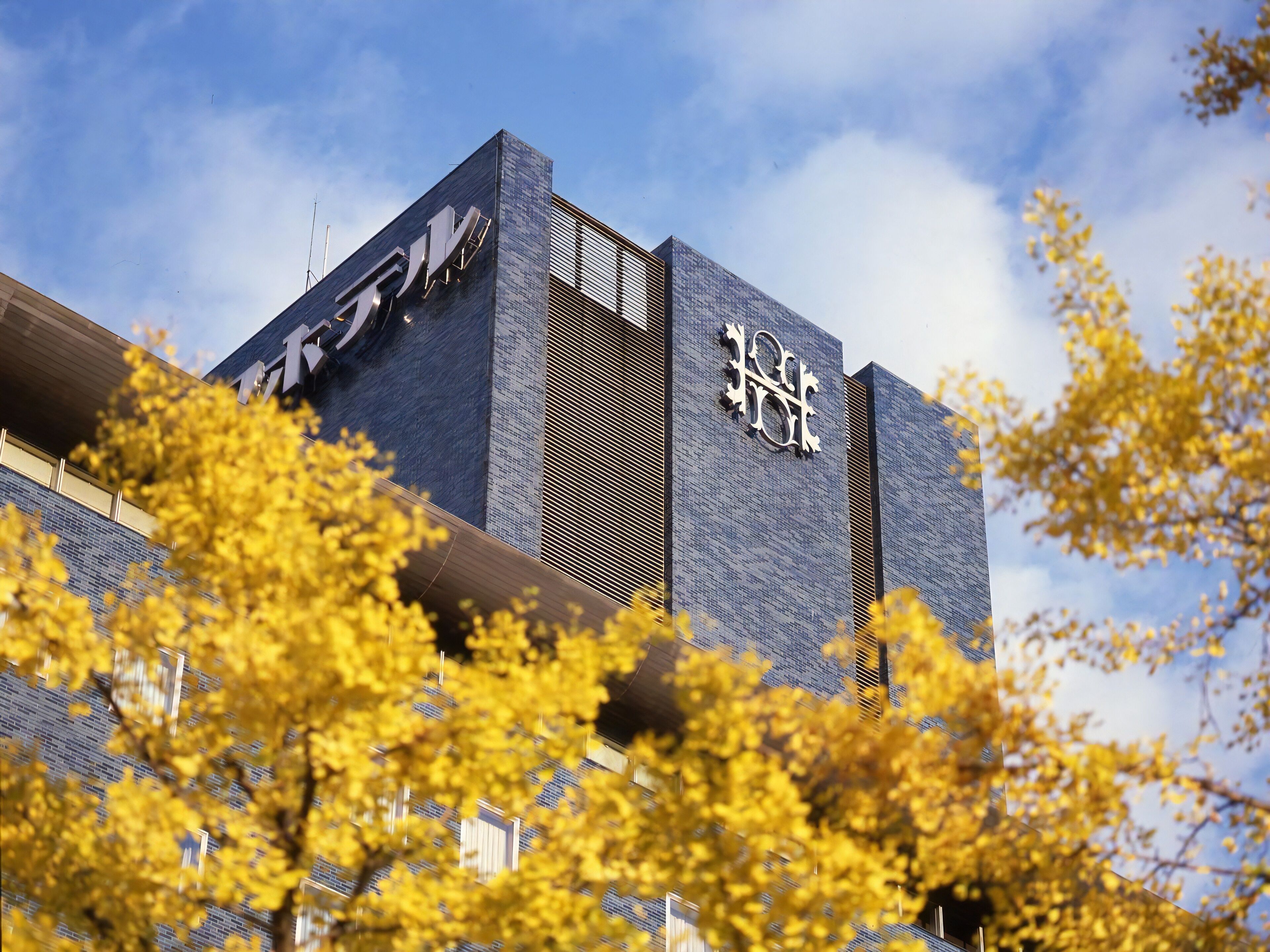 A modern building with a prominent logo on the facade.