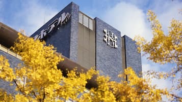 A modern building with a prominent logo on the facade.