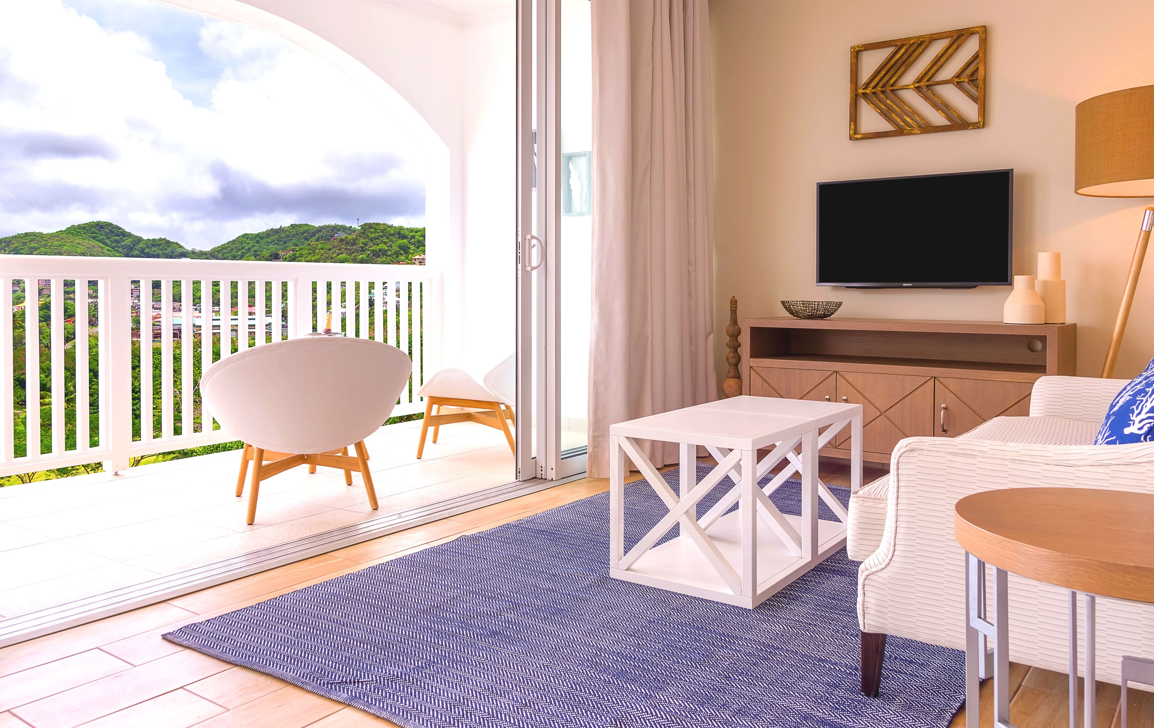 studio suite, 1 king bed, balcony, sea view (cinnamon) | living area | 42-inch flat-screen tv with cable channels, tv, dvd player