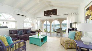 Deluxe Villa, 2 Bedrooms, Balcony, Ocean View | Living area | 42-inch flat-screen TV with cable channels, TV, DVD player