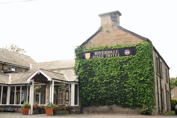 A building with a sign reading "Riverdale Hall Hotel" and ivy-covered walls. - Riverdale Hall Hotel (Hexham)