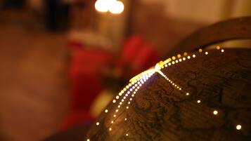 A close-up of a globe with a string of lights.