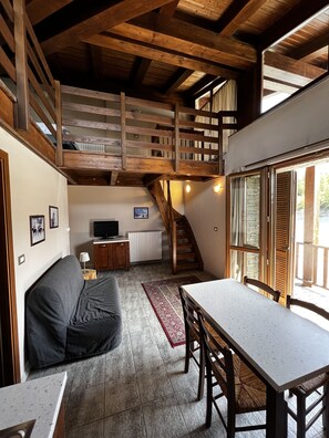 Large 2 bedrooms apartment with balcony and mountain view - split level | Living area | LCD TV, pay movies - Chalet Edelweiss (Sestriere)