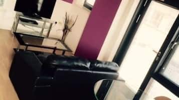 City Apartment, 1 Bedroom | Living room | LCD TV