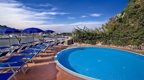 Indoor pool, outdoor pool, pool umbrellas, pool loungers