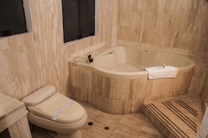 Suite, Jetted Tub | Bathroom | Combined shower/bathtub, deep-soaking bathtub, free toiletries