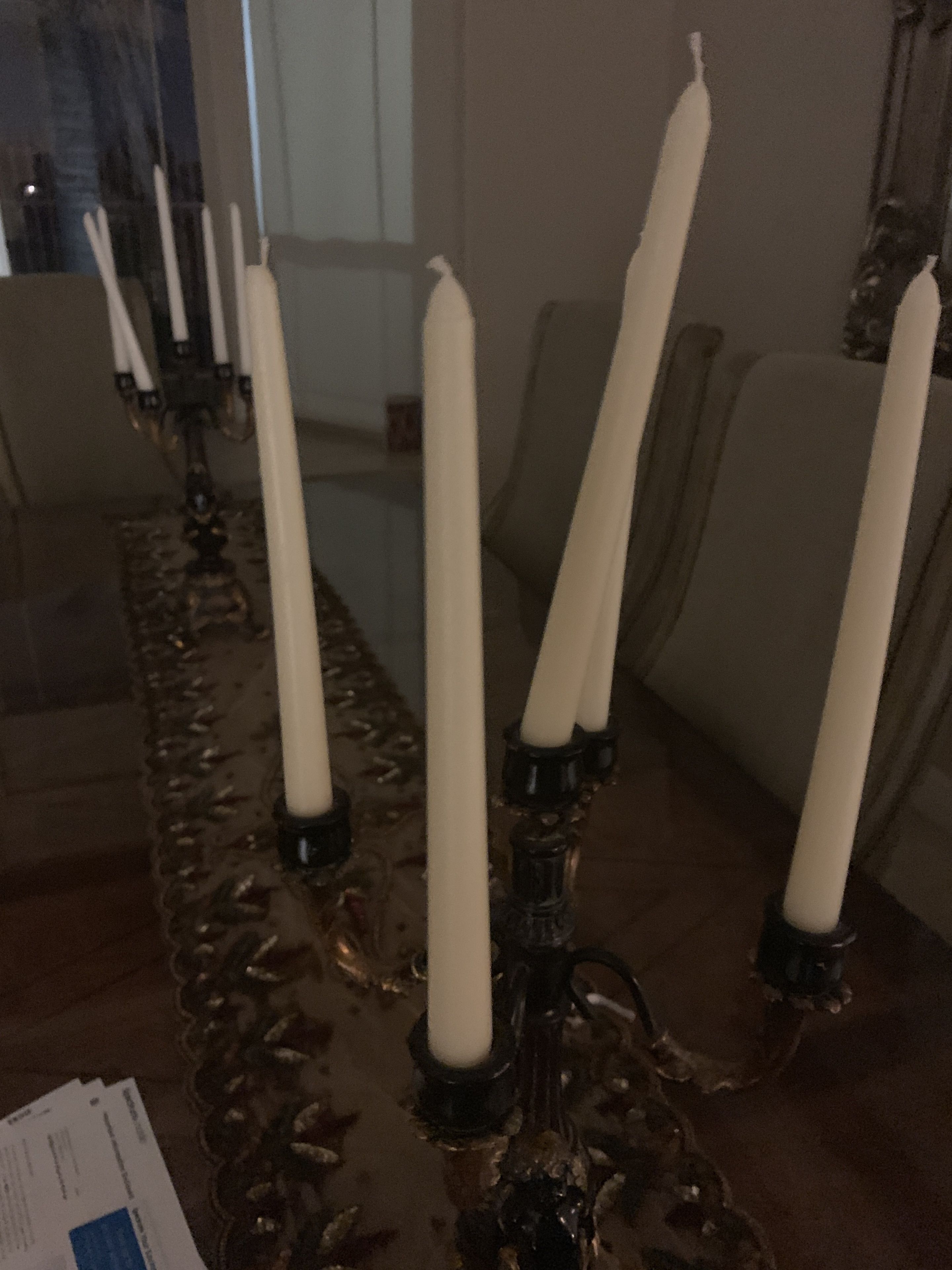 A table with a candle holder and candles.