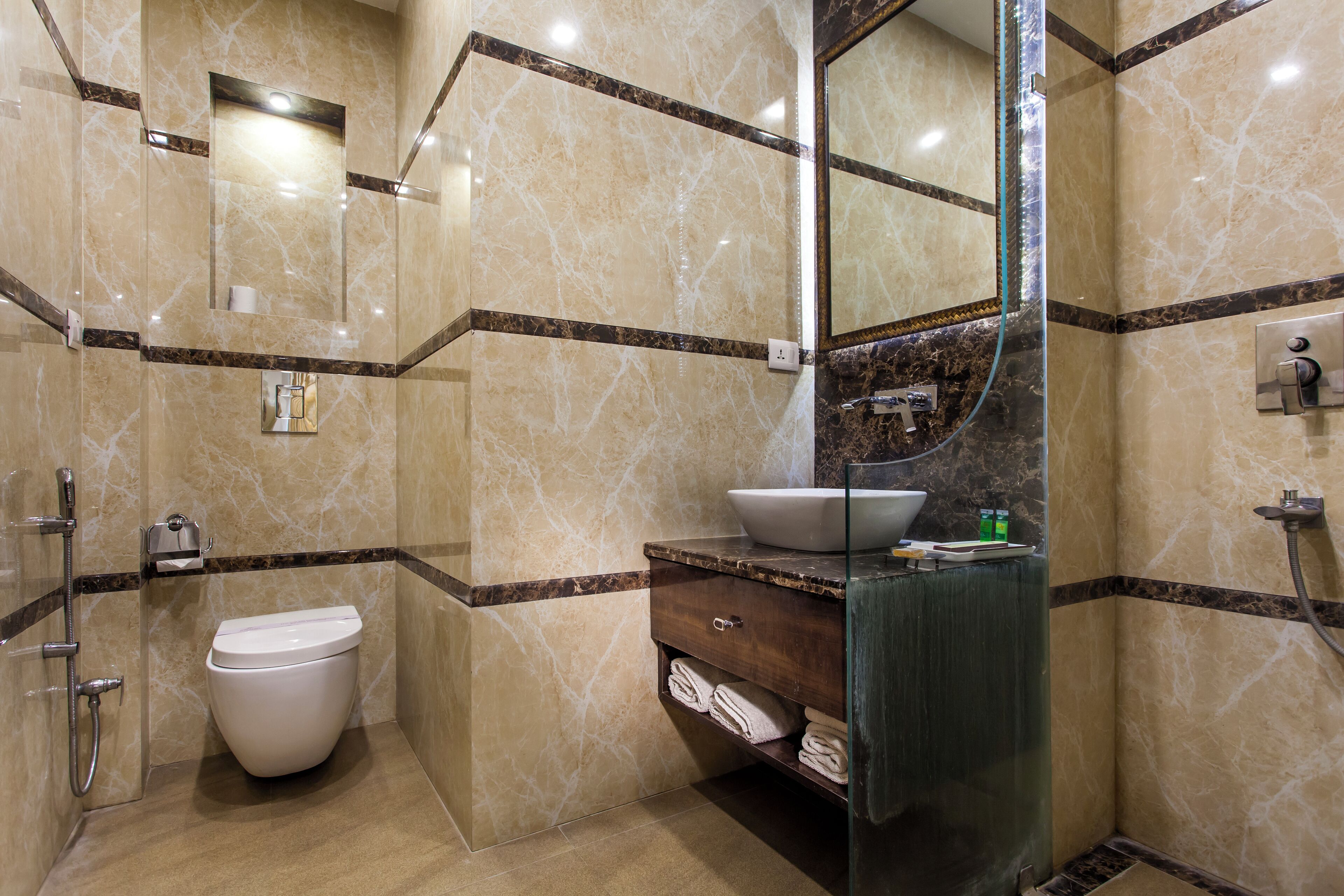 A bathroom with a toilet, sink, and shower.
