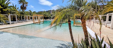 Seasonal outdoor pool, free pool cabanas, pool umbrellas