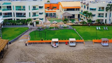 On the beach, beach umbrellas, beach towels, beach massages