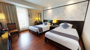 Habitación Deluxe | Ropa de cama de alta calidad, colchones con acolchado adicional, minibar