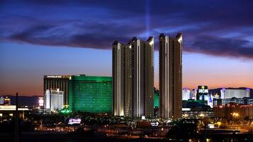 A high-rise hotel with multiple floors, large windows, and a prominent sign.
