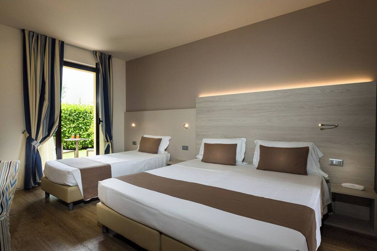 Superior Triple Room | Minibar, in-room safe, desk, soundproofing