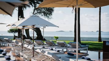 Indoor pool, outdoor pool, pool umbrellas, pool loungers