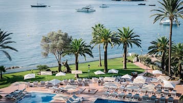 Indoor pool, outdoor pool, pool umbrellas, pool loungers