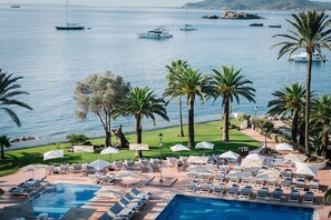 Indoor pool, outdoor pool, pool umbrellas, pool loungers