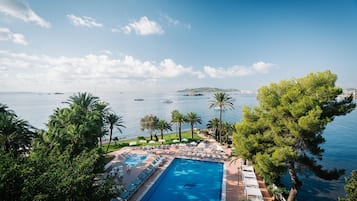 Indoor pool, outdoor pool, pool umbrellas, pool loungers