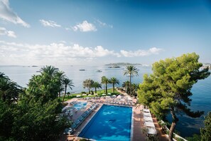 Indoor pool, outdoor pool, pool umbrellas, pool loungers