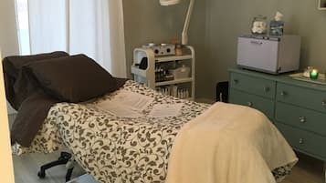 Cozy retreat with a bed, desk, and dresser, offering a comfortable space to unwind.