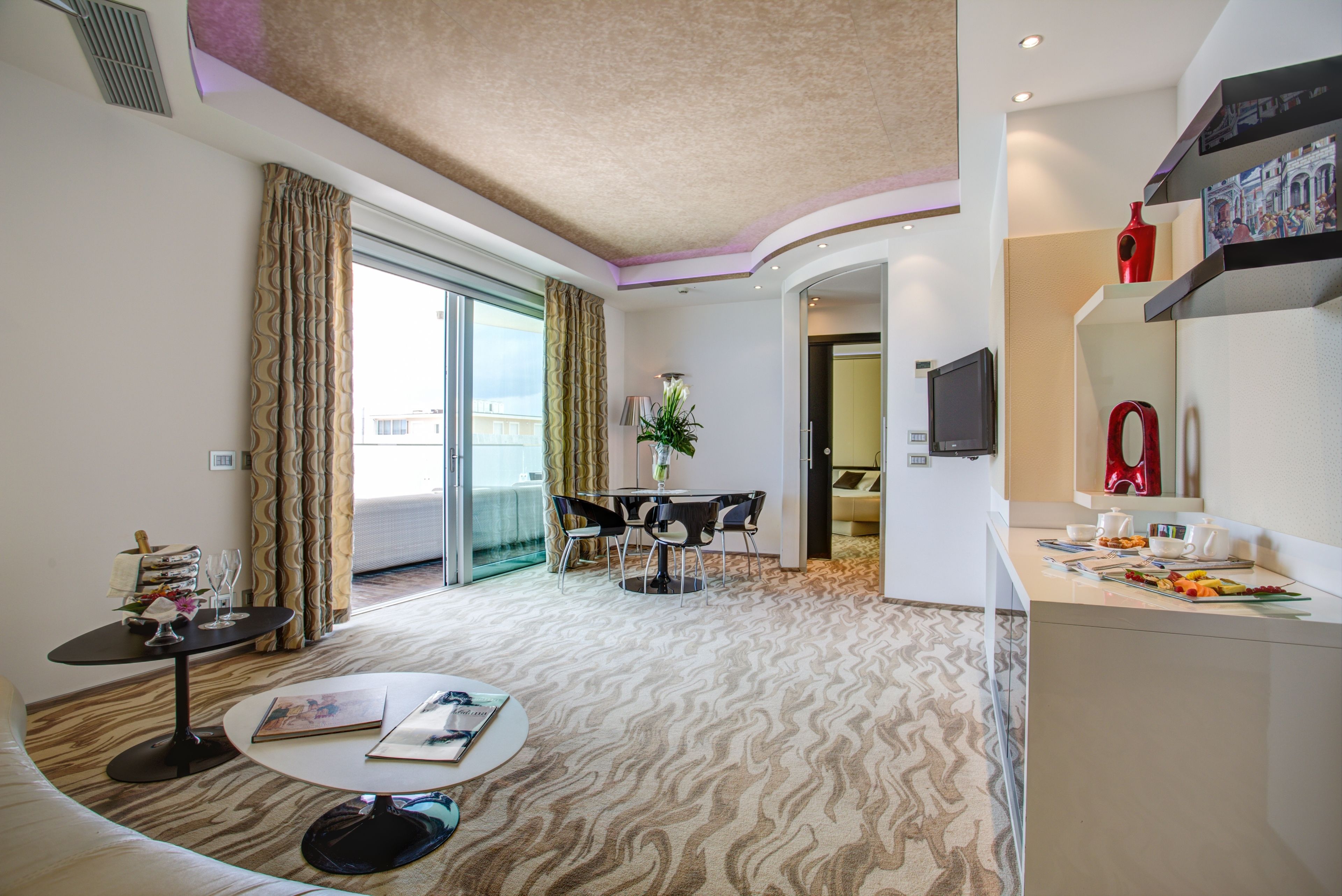 luxury suite (4 people) | living area | 32-inch lcd tv with satellite channels, first-run films