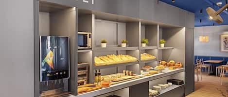 A buffet area with a variety of food items and a television screen.