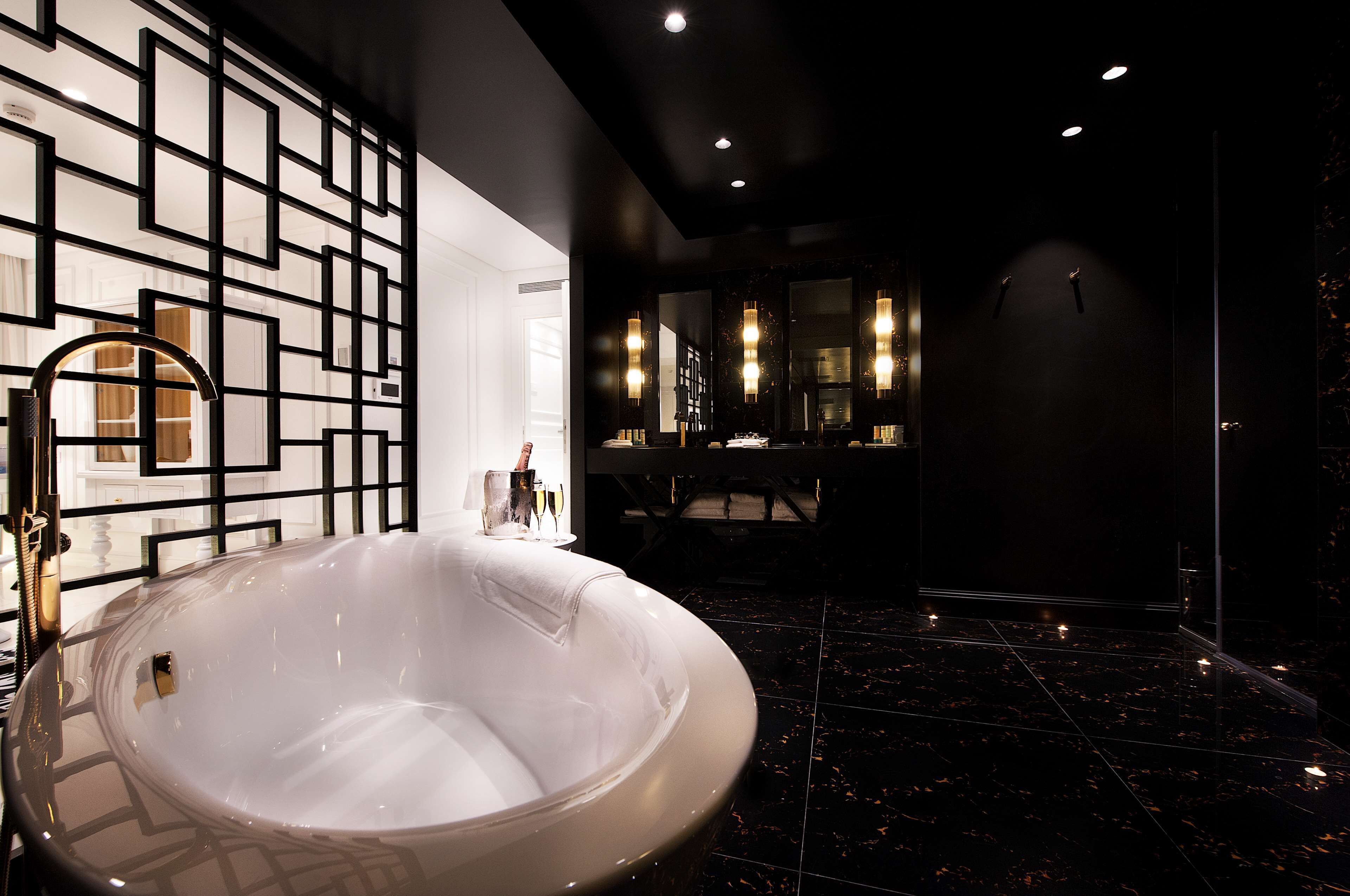 combined shower/bathtub, designer toiletries, hair dryer, slippers