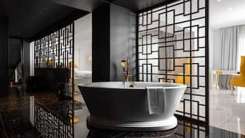 Combined shower/tub, designer toiletries, hair dryer, slippers