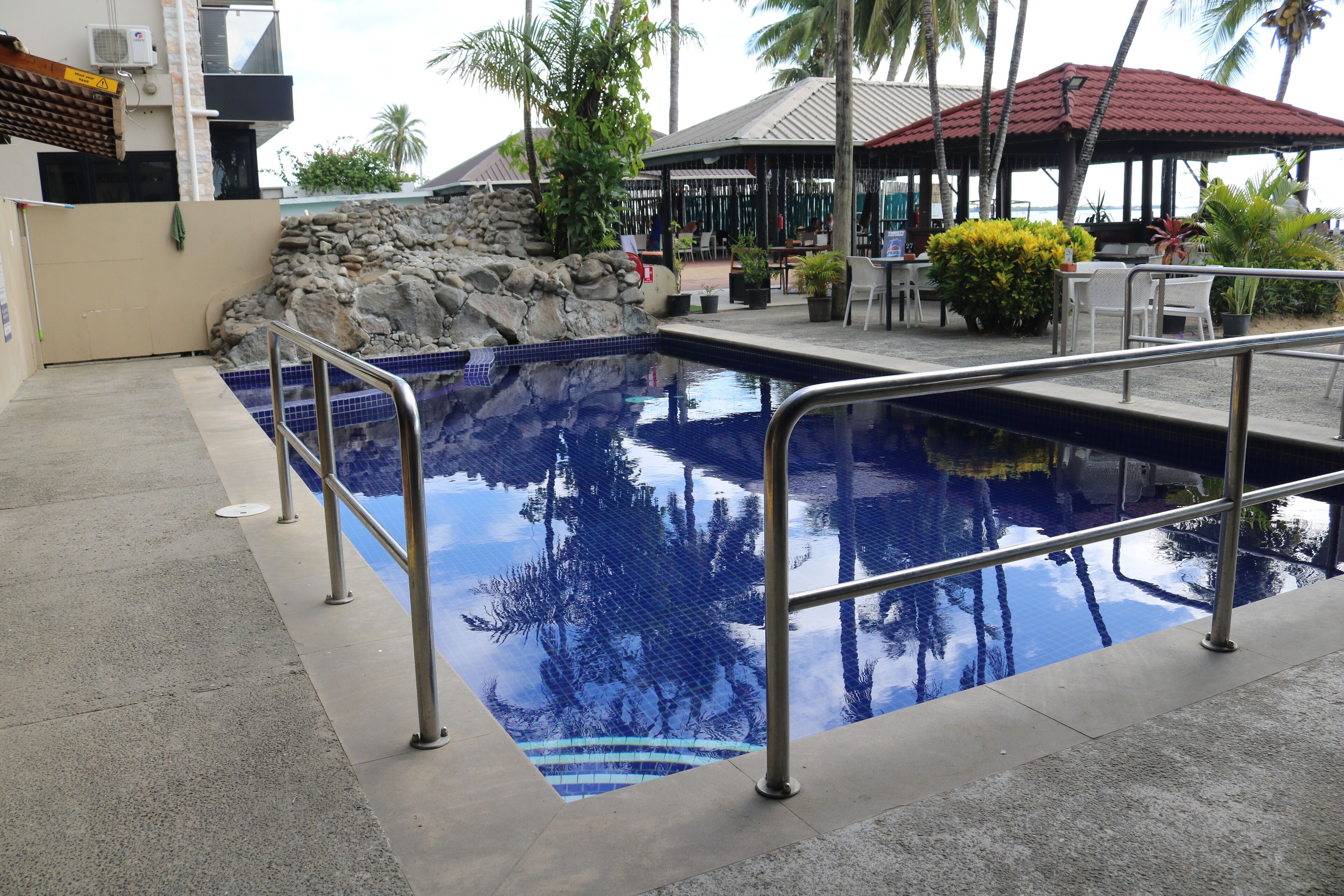 outdoor pool, open 8:30 am to 6:00 pm, pool umbrellas, pool loungers